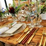 Beautifully arranged table with elegant cutlery and floral decoration, perfect for fine dining.